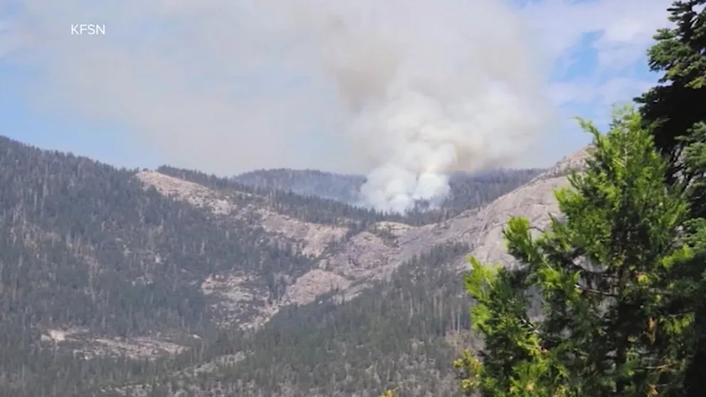 Smoke rises near a wildfire response scene in Yosemite National Park